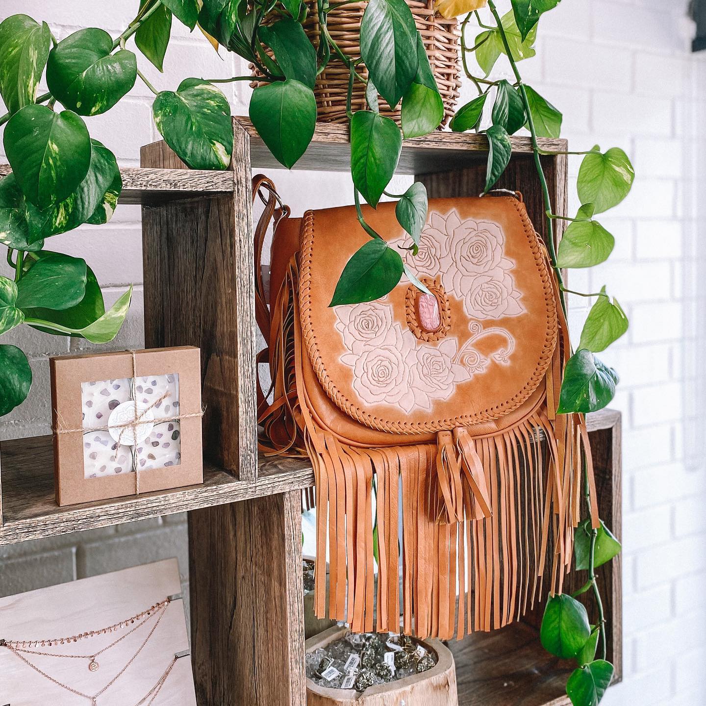 earthy-toned leather plant sleeve in sunlit corner