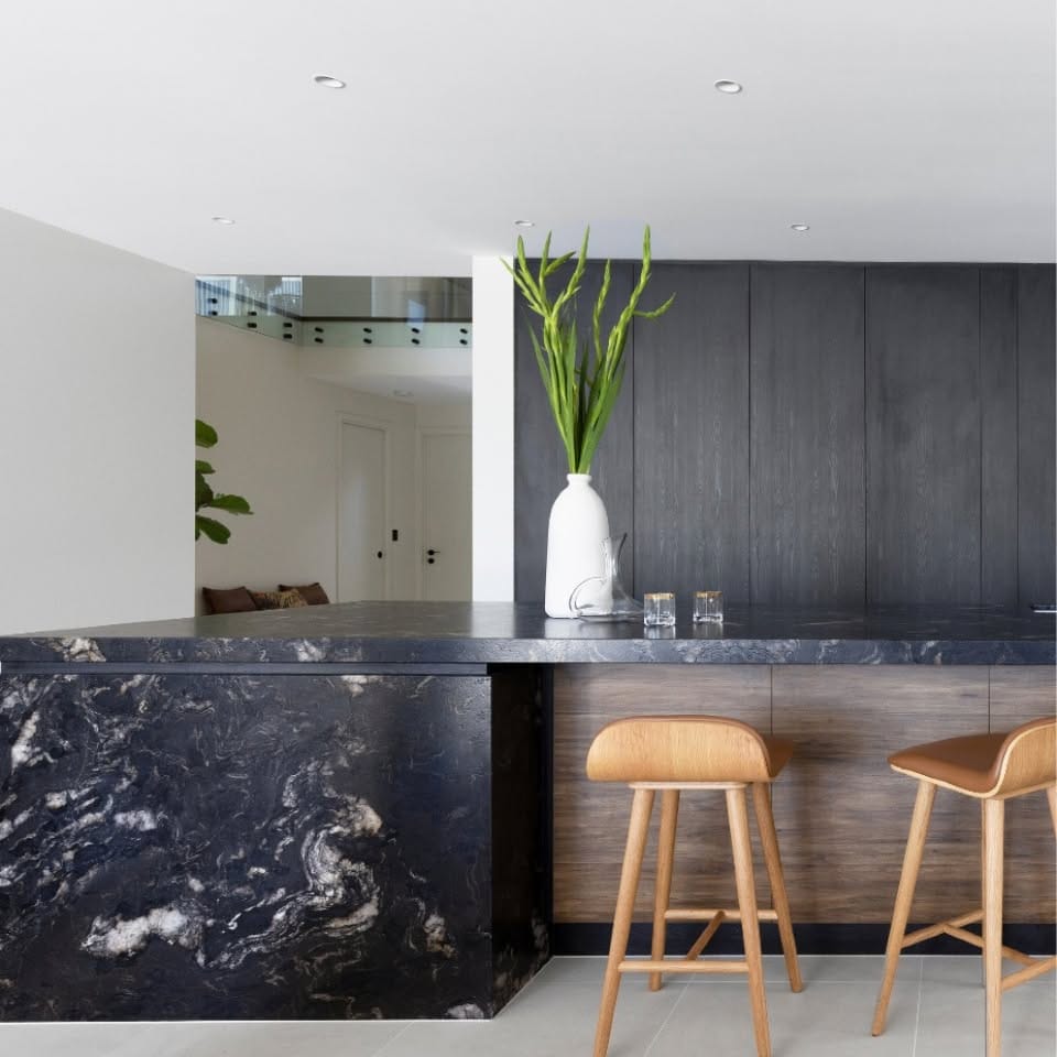 marble-look planter with herbs on kitchen counter