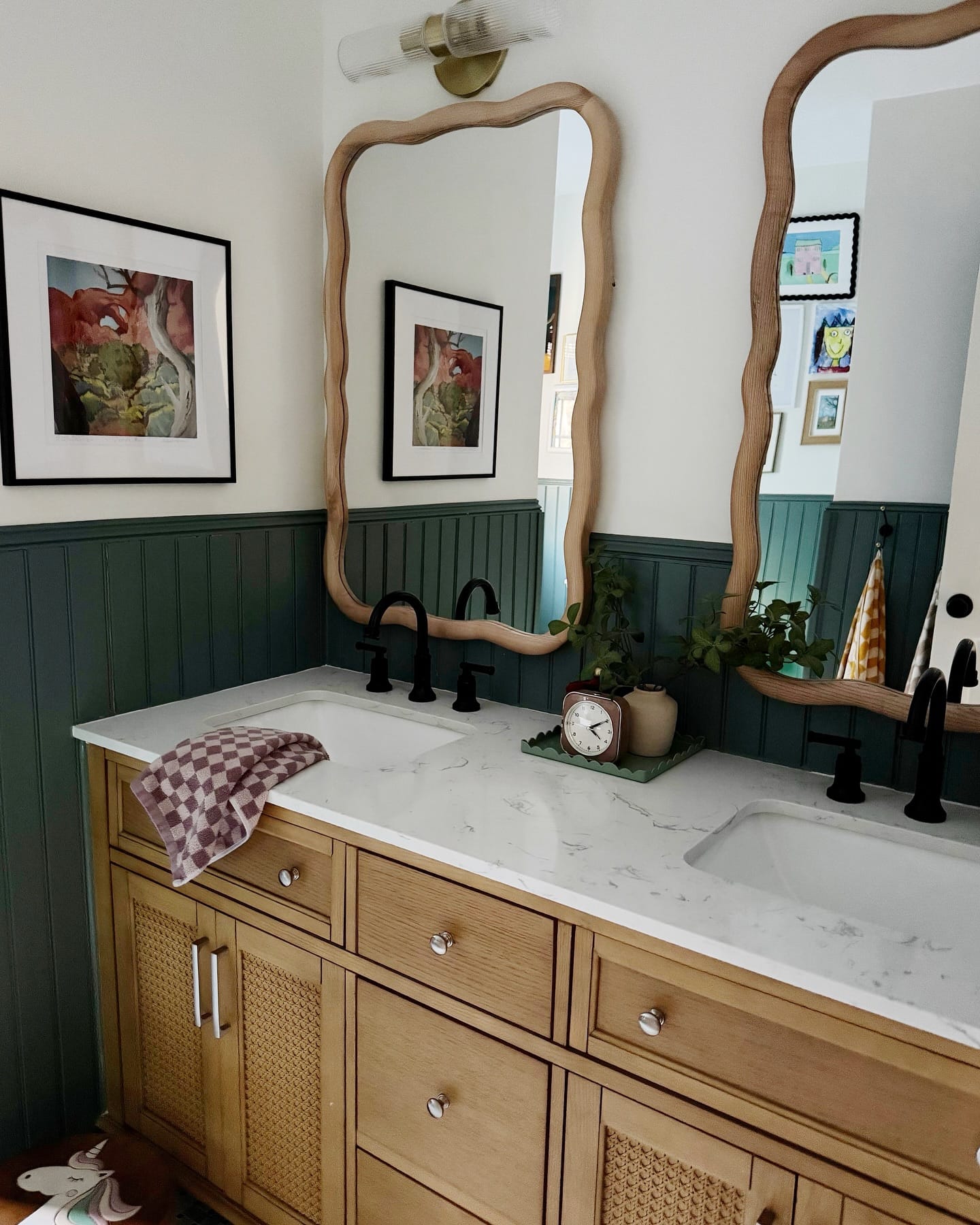 decorative green wall hooks with towels