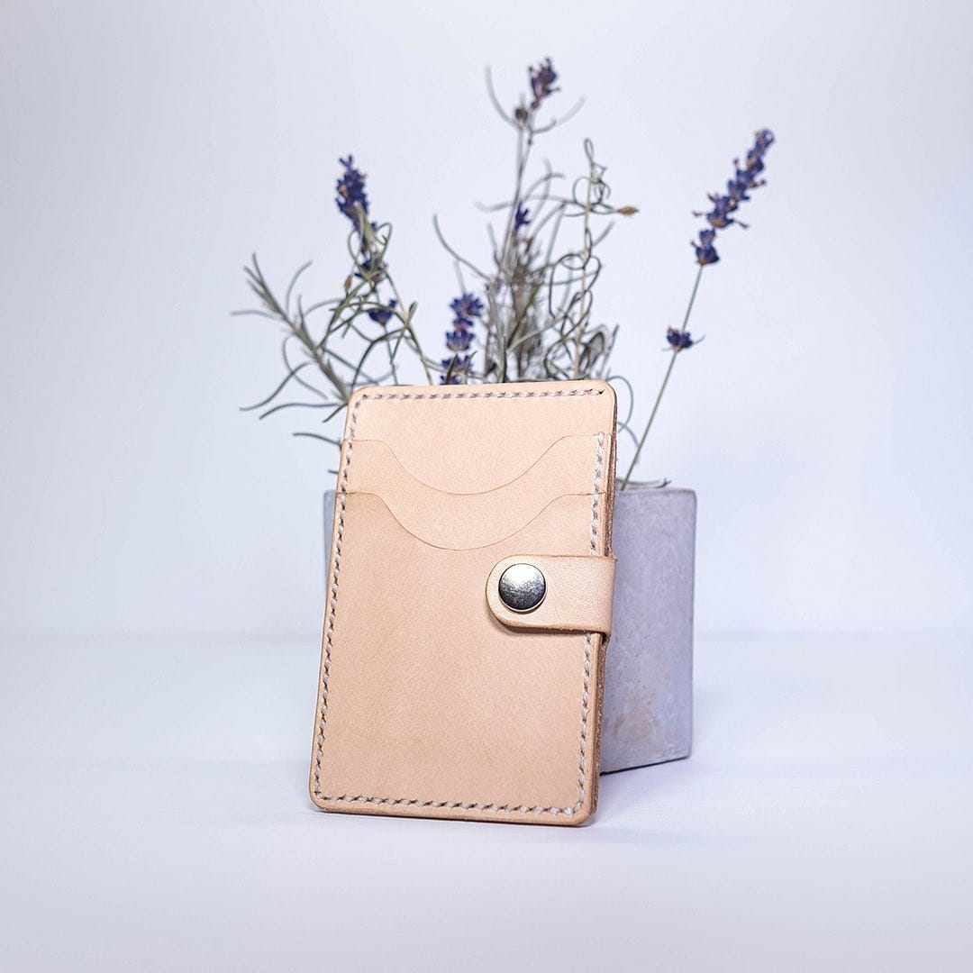 minimalist leather plant sleeve in monochrome room